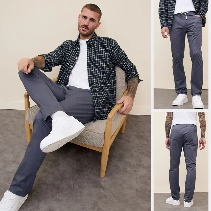 Geruit overhemd, wit T-shirt en grijze broek met comfortband.